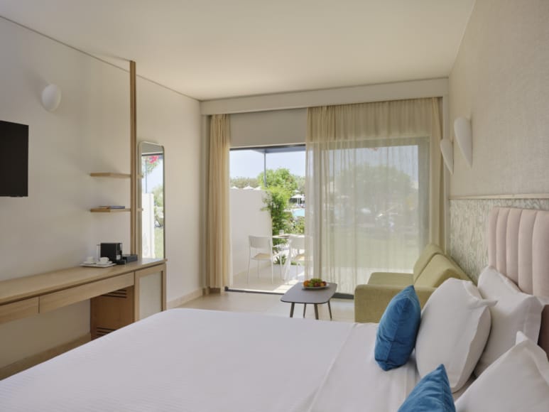 a bedroom with a bed and a couch