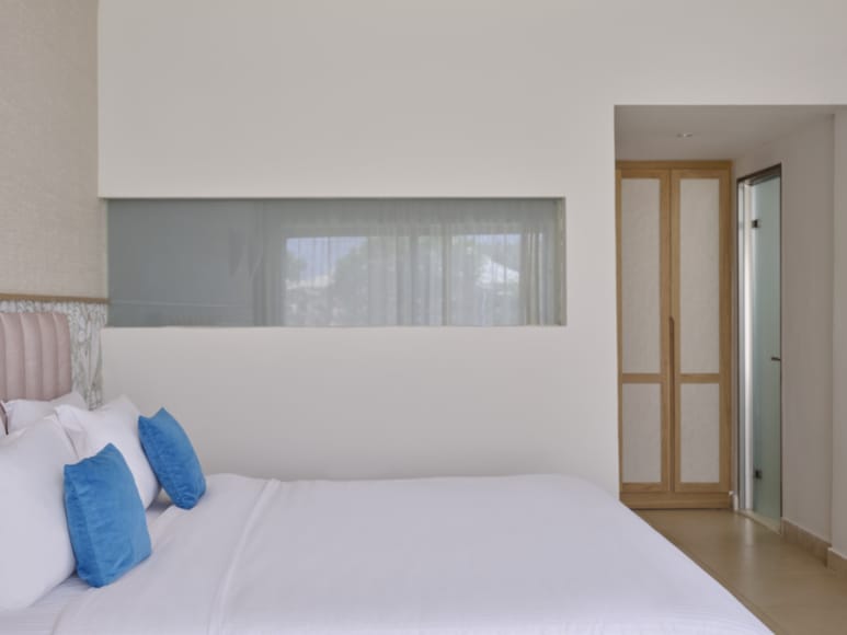 a bed with blue pillows