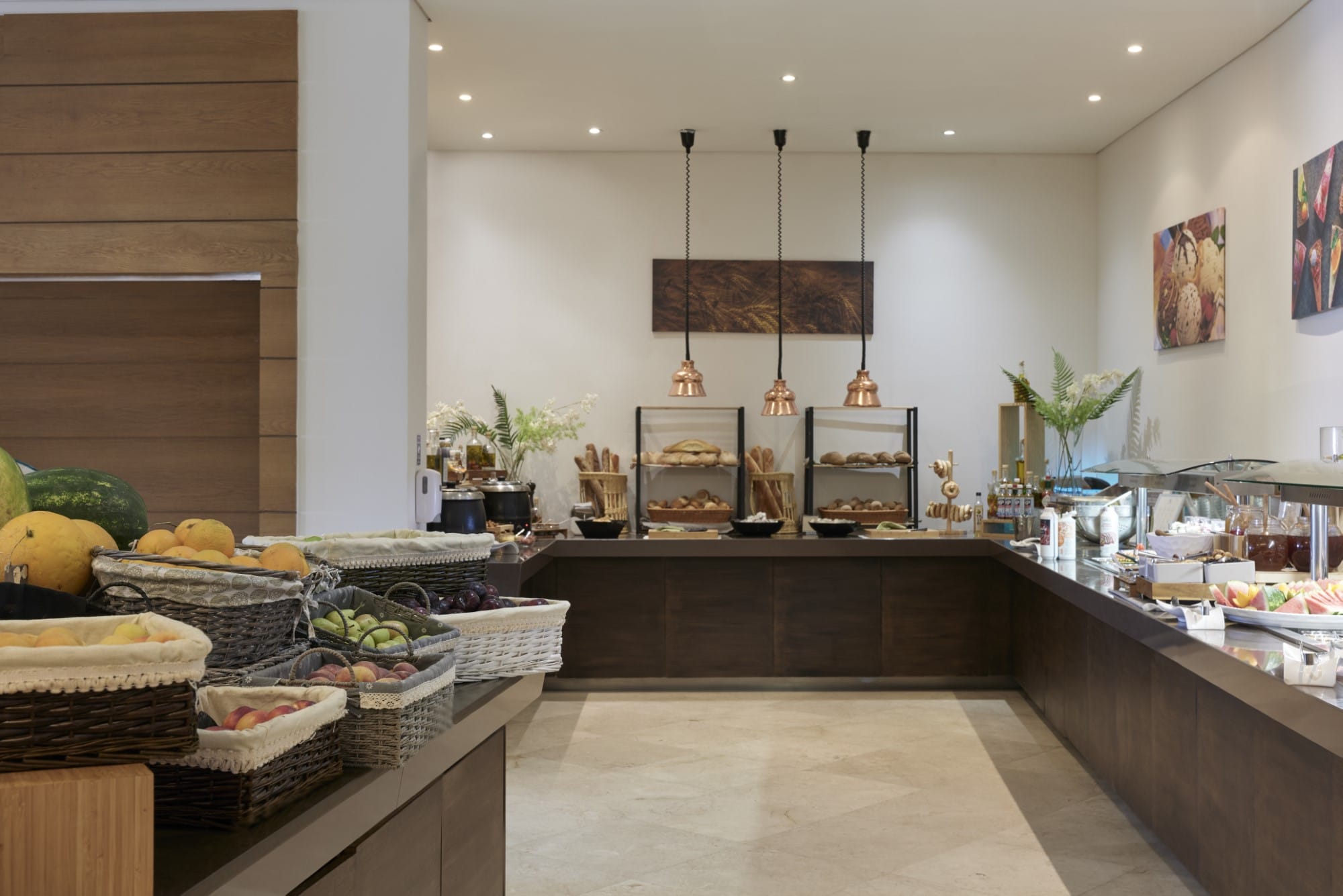 a large room with a counter and food on it