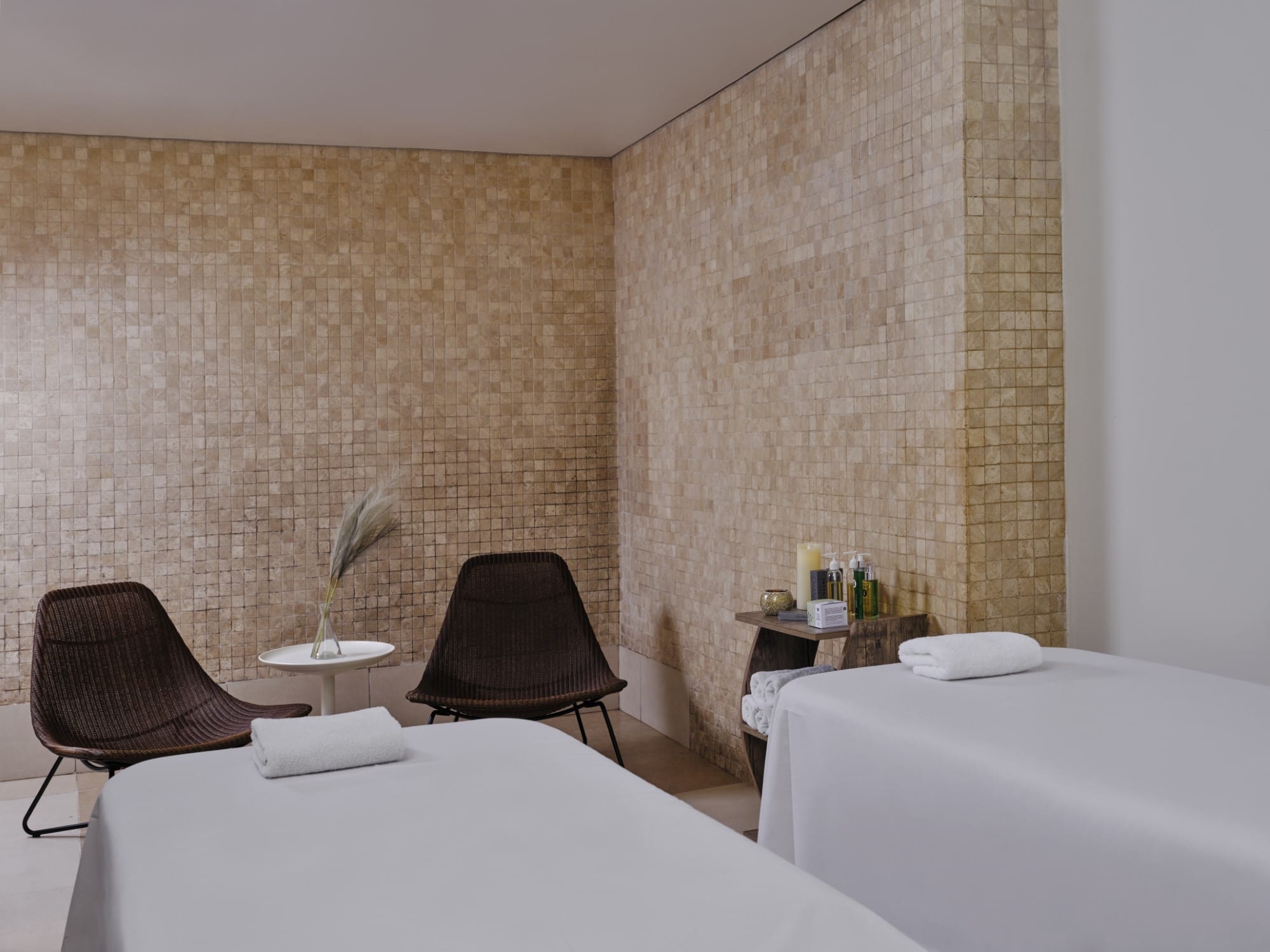 a hotel room with a bed and a chair