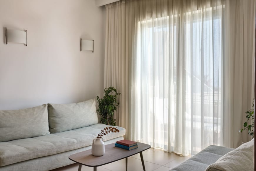 a white couch and a table