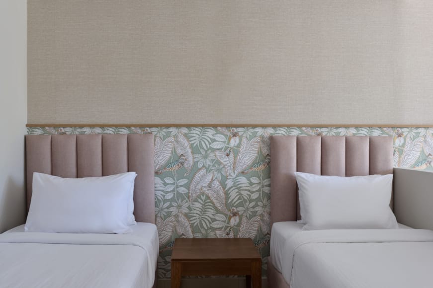 a room with white couches and a table