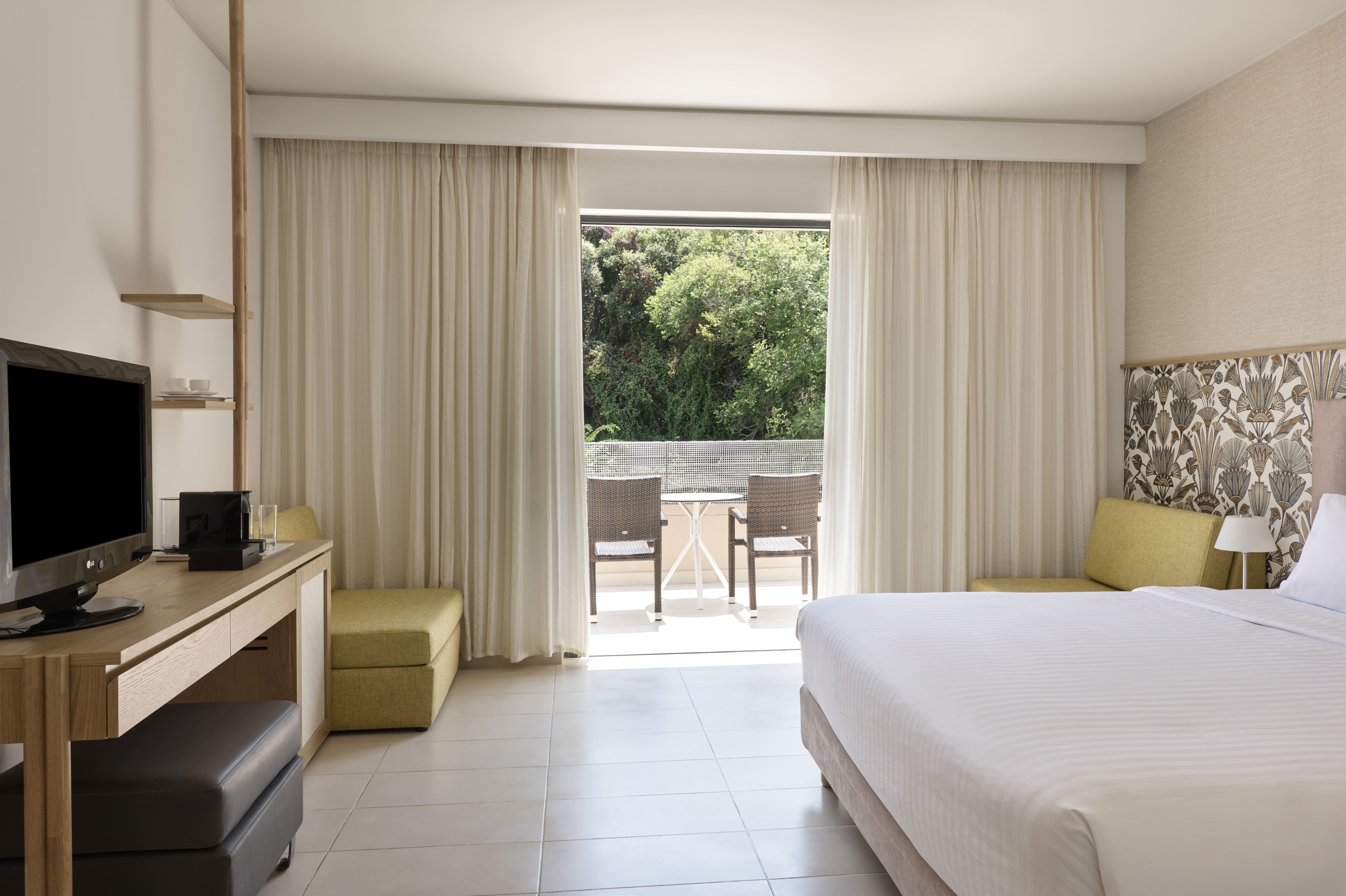 a room with a bed and a desk