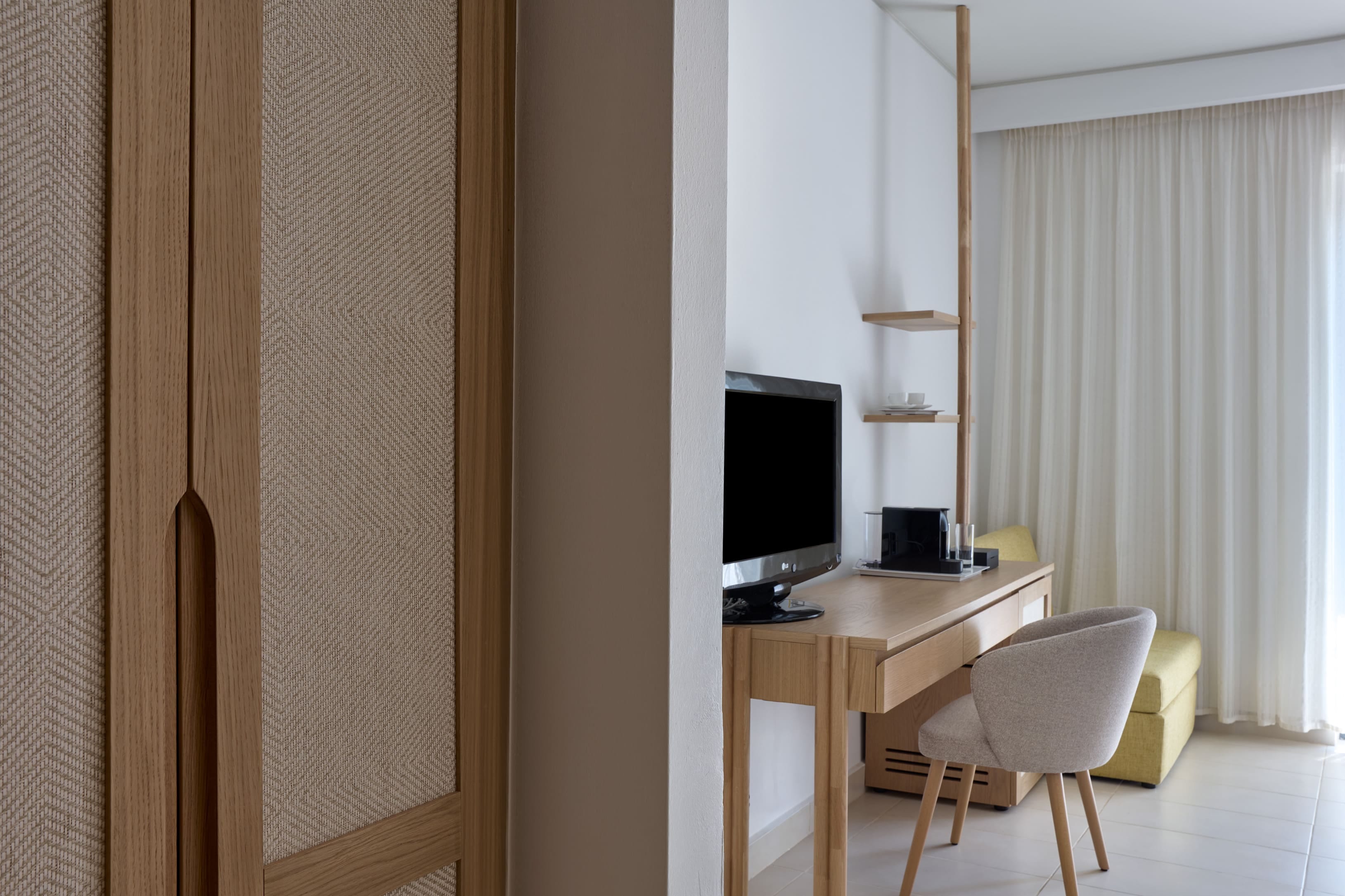 a room with a desk and a computer