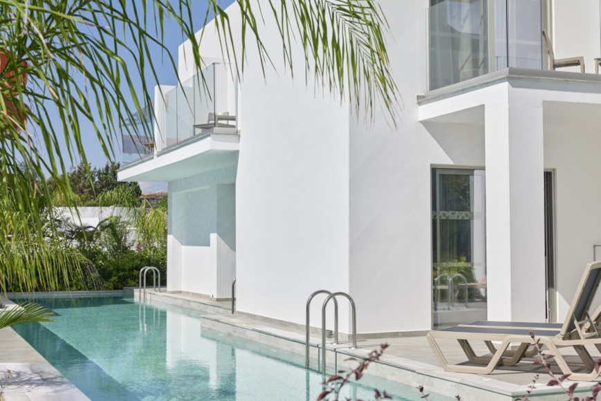 a swimming pool in a white building