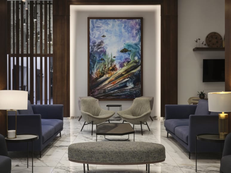 a living room with a large painting