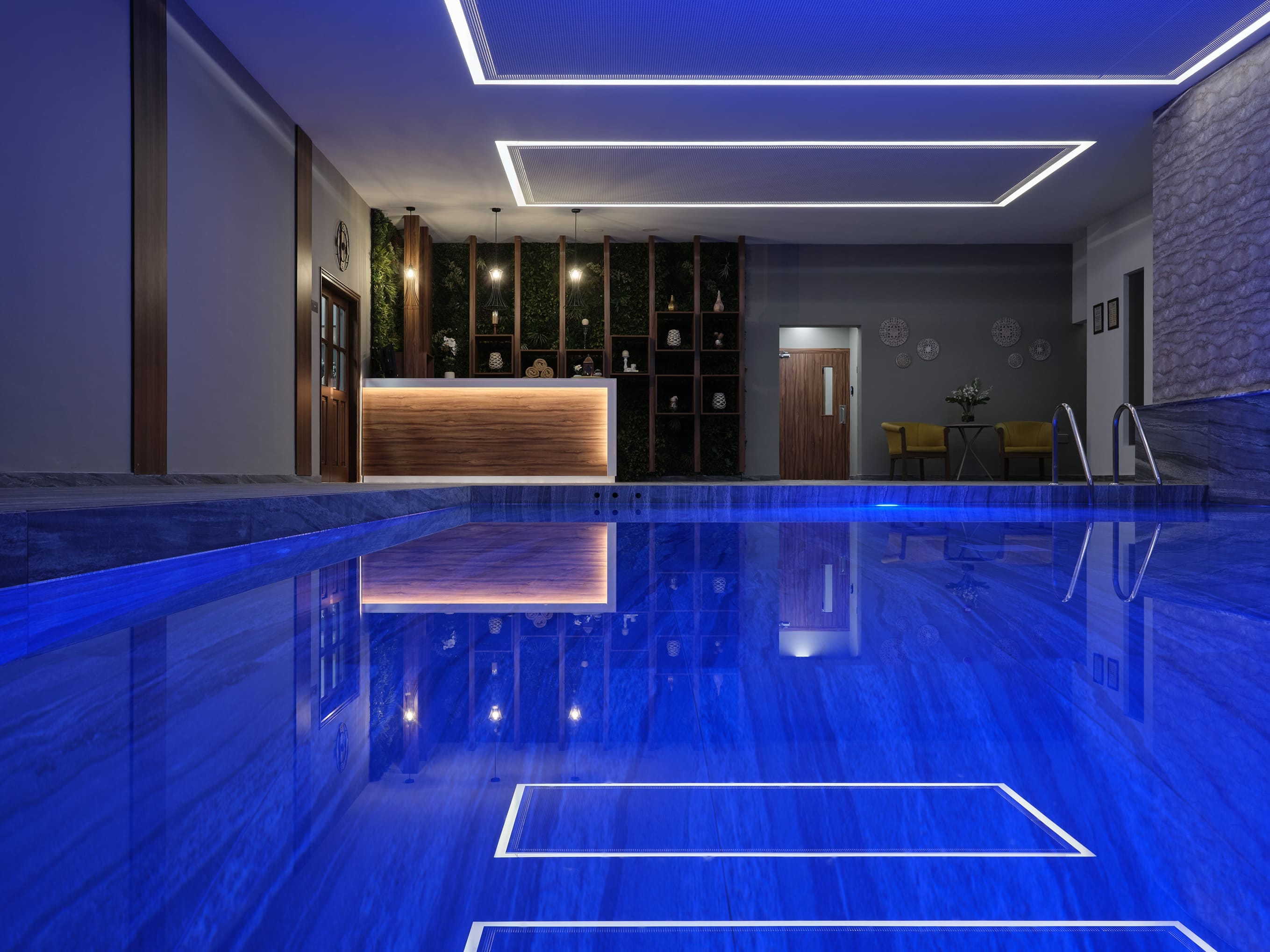 a swimming pool with a blue floor