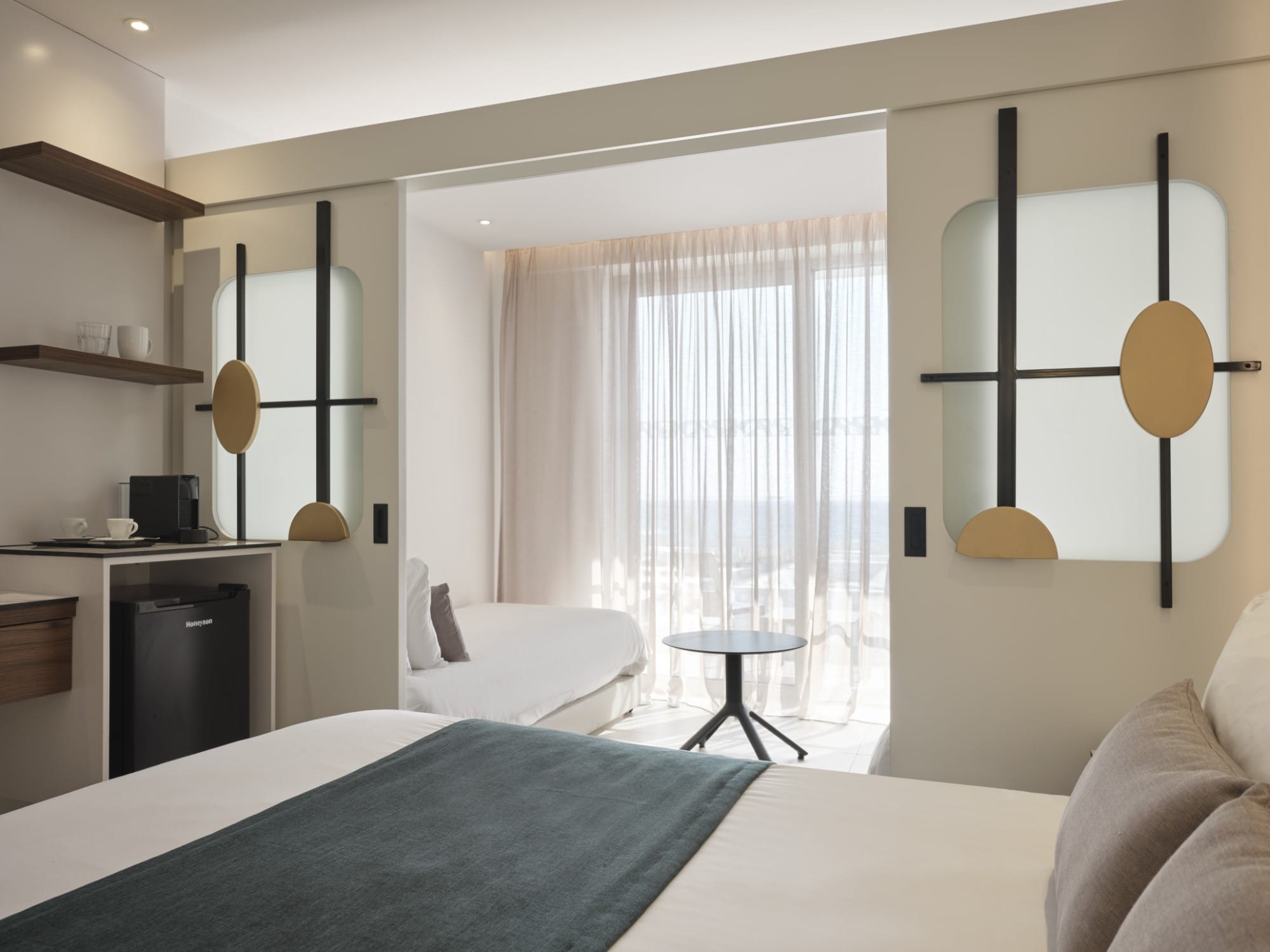 a bedroom with a bed and a mirror