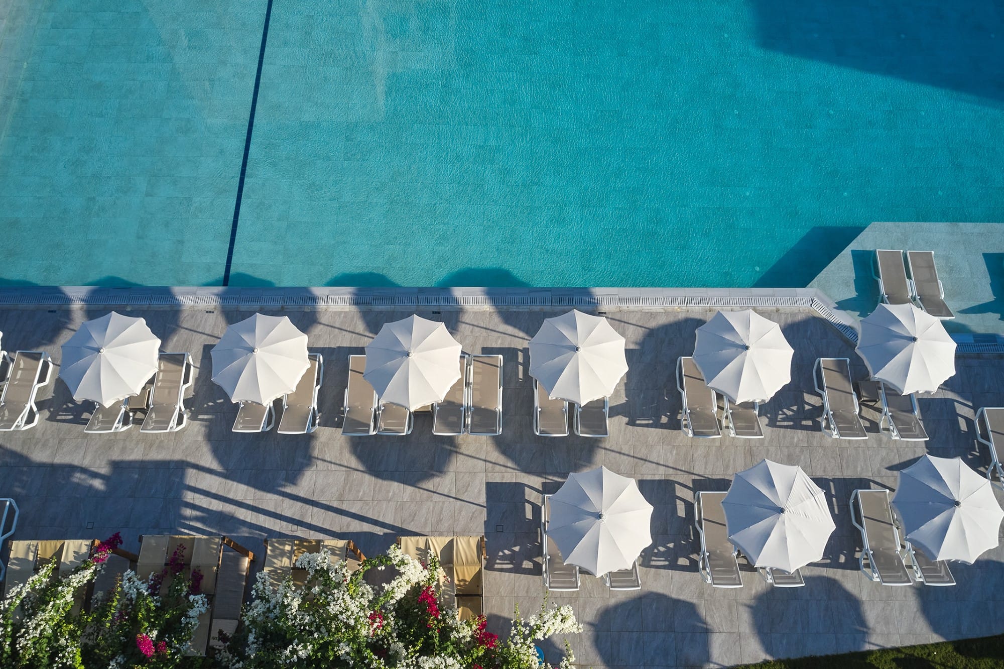 a building with a pool in the background