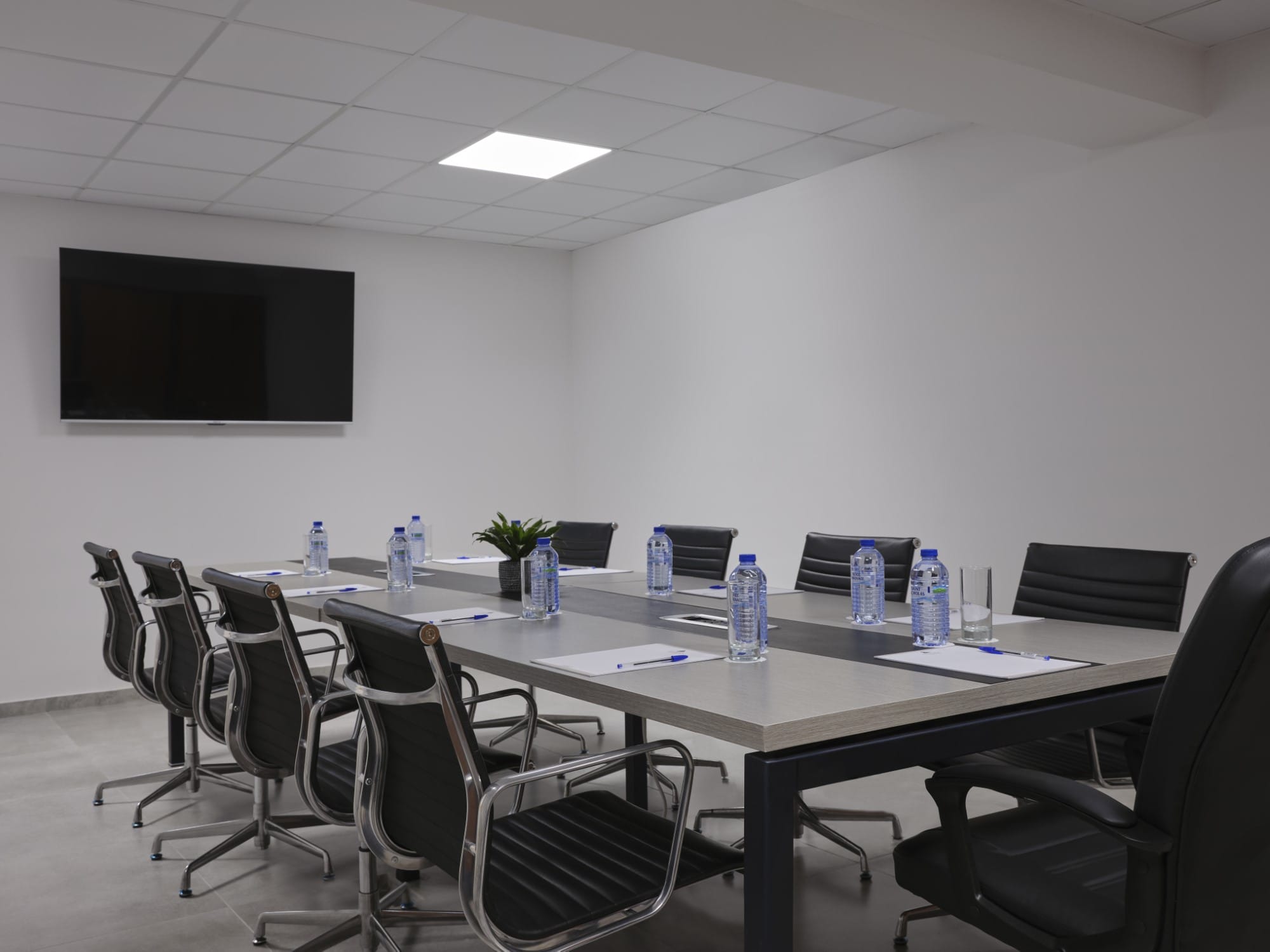 a conference room with a large screen