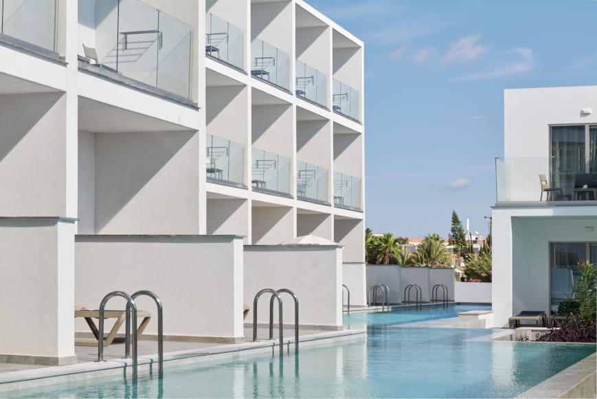 a swimming pool in a white building