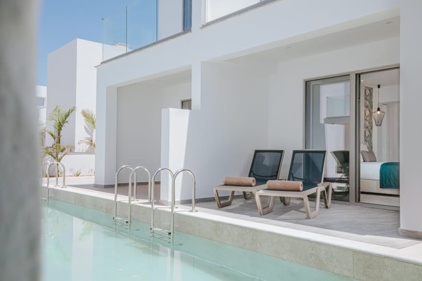 a room with a pool table and a tv