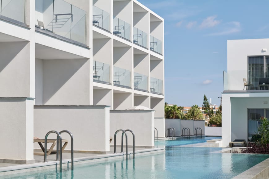 a swimming pool in a white building