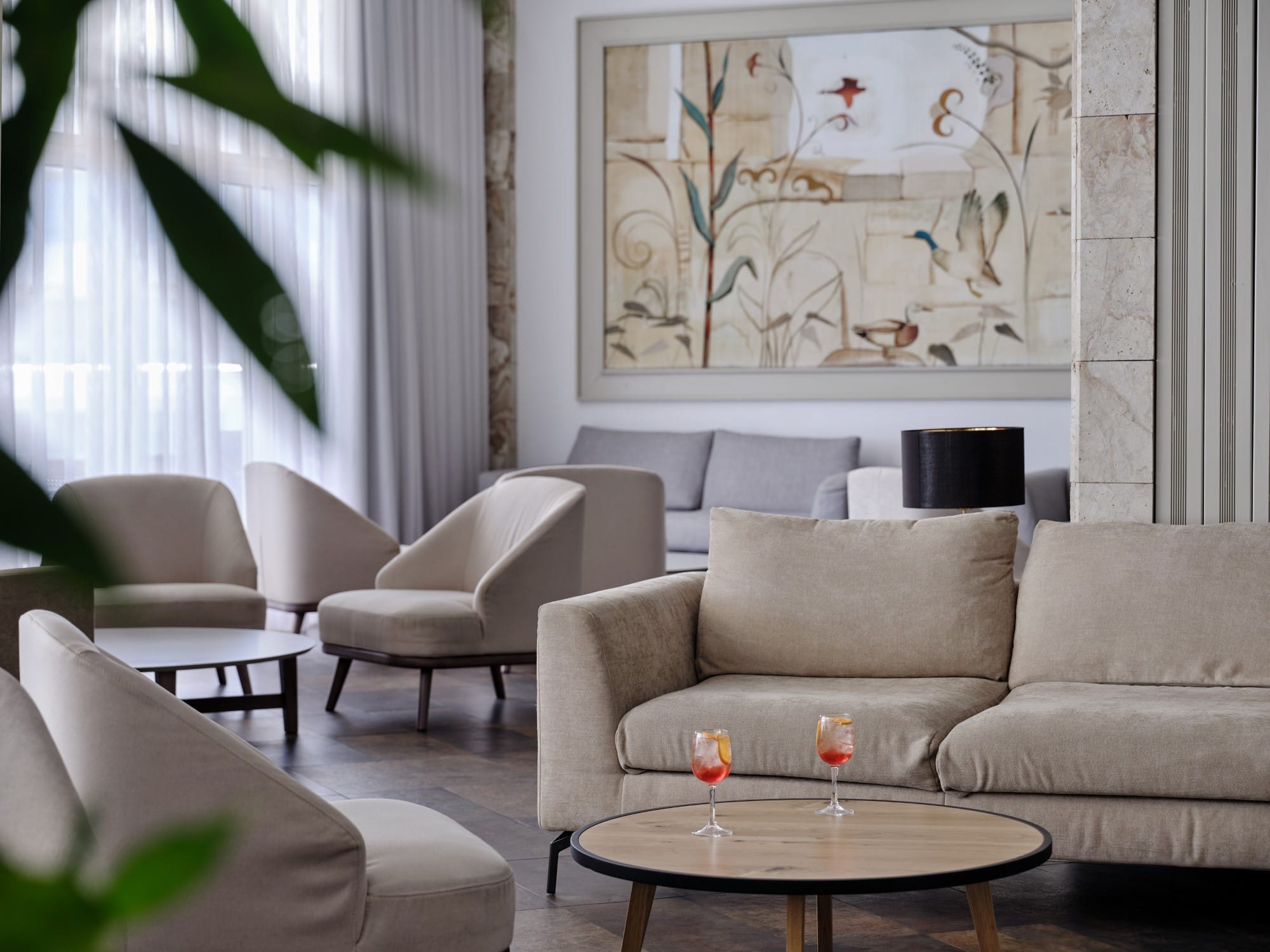 a living room with a couch and chairs