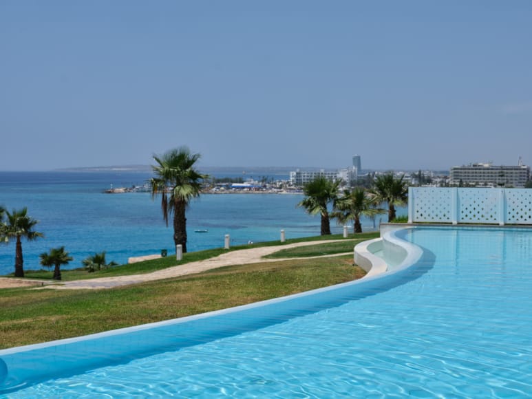 a pool next to a beach