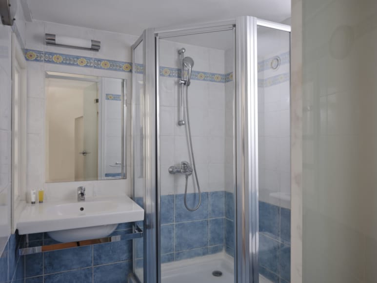 a bathroom with a glass shower