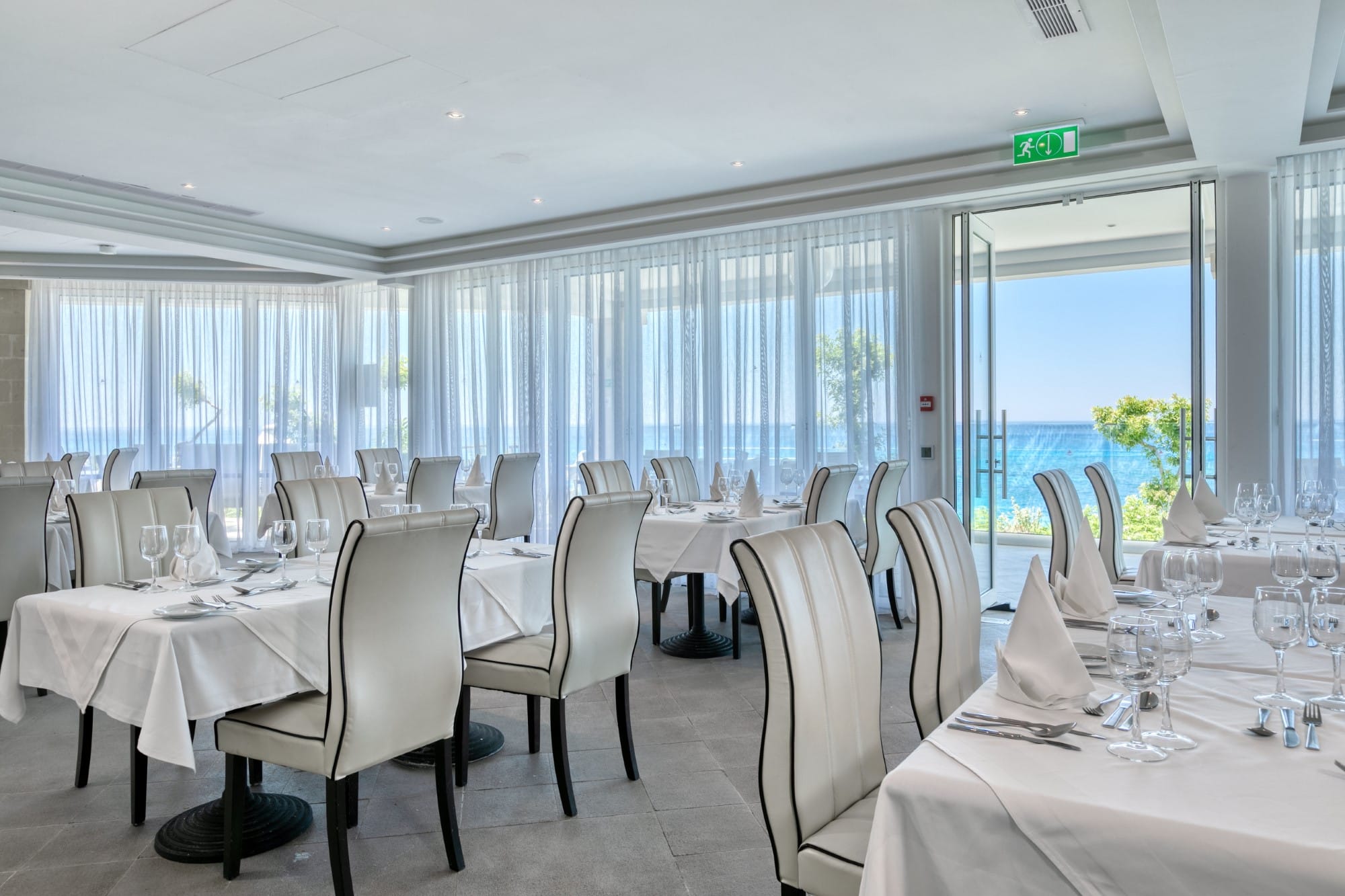 a room with tables and chairs