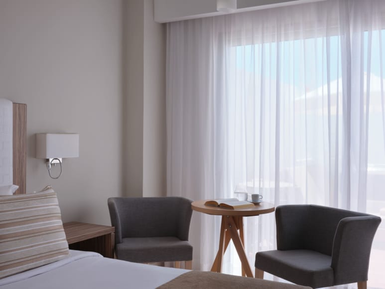 a room with a table and chairs