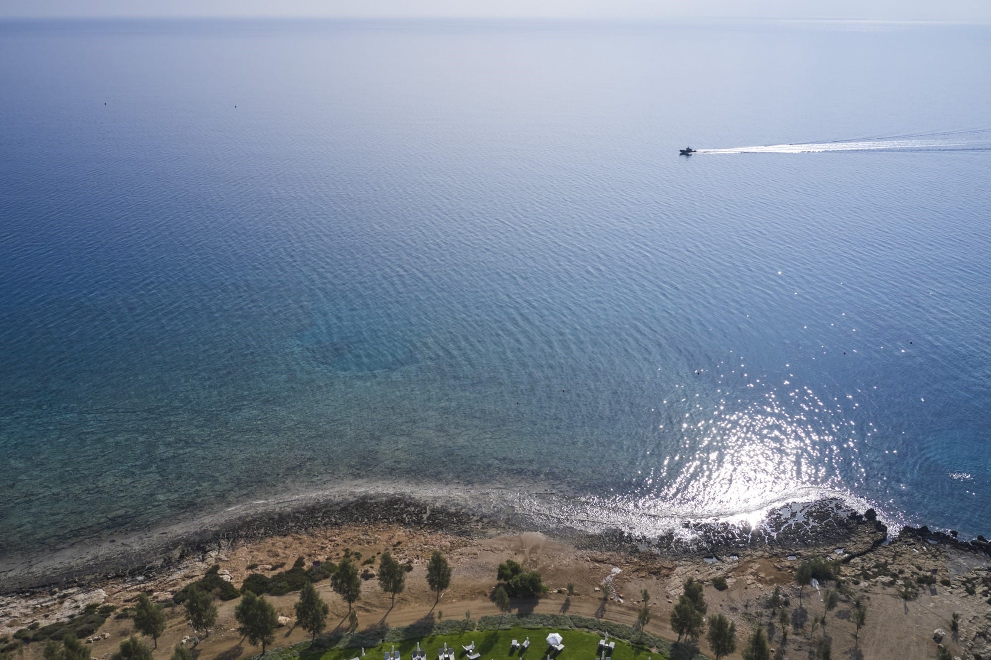 a landscape with a body of water and land with trees