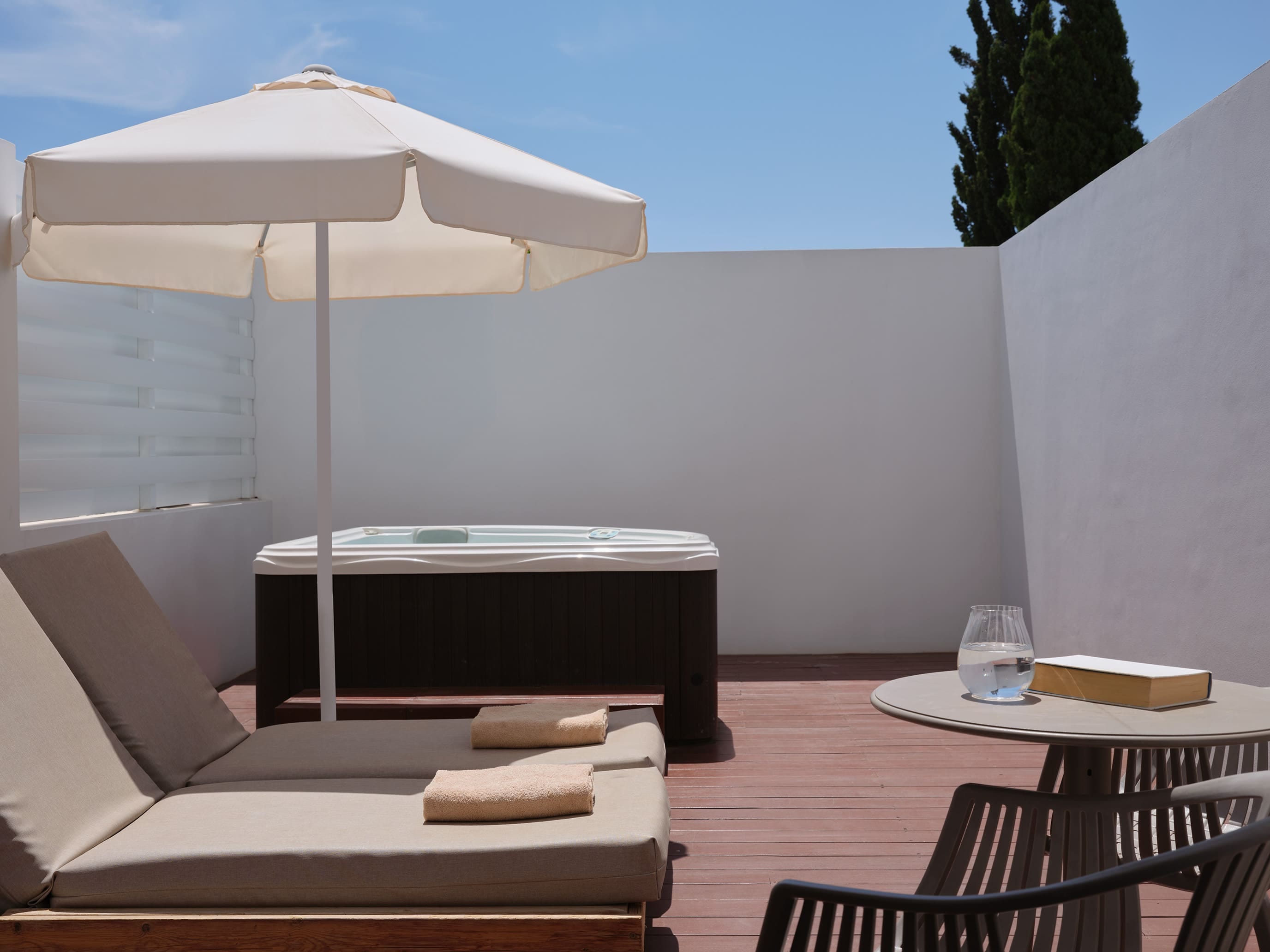 a white umbrella and a table