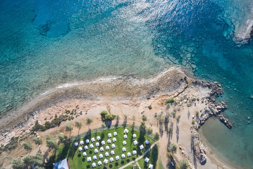 a large area with a body of water in the background