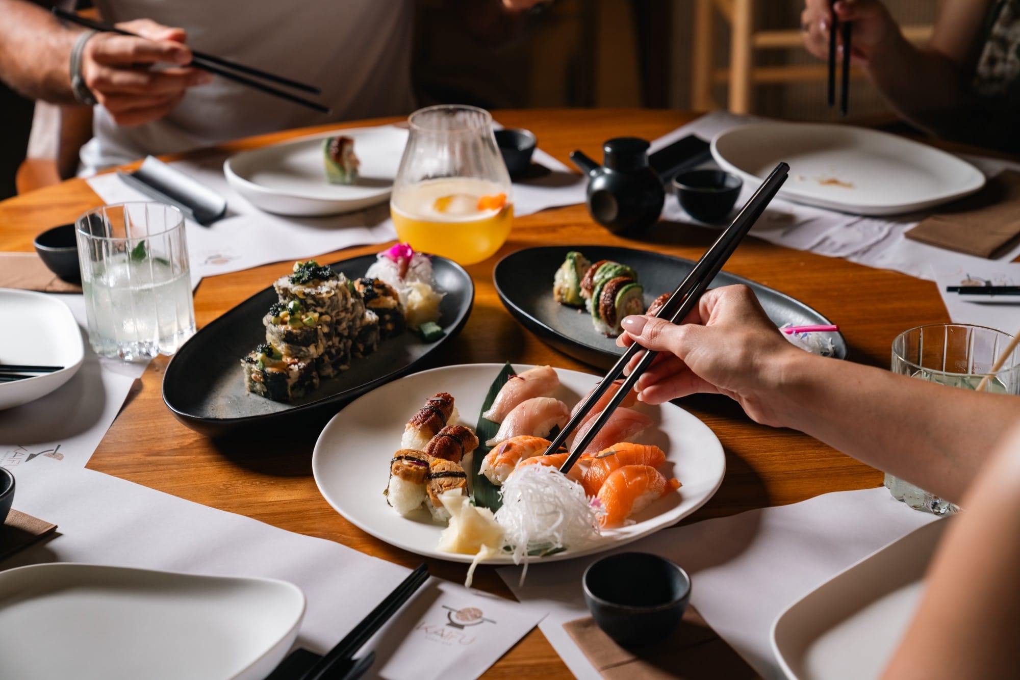 a person eating food at a restaurant