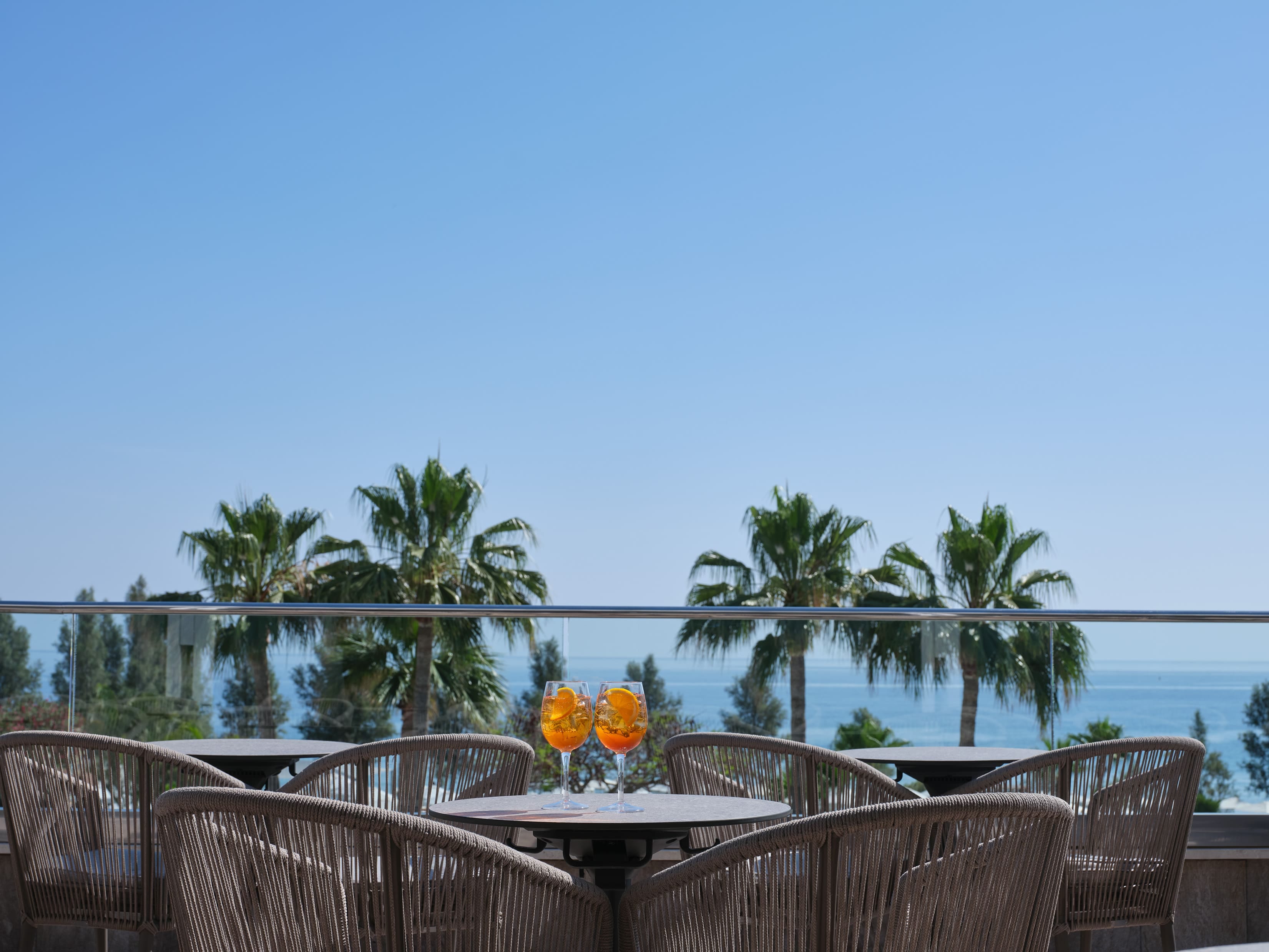 a table and chairs by a beach