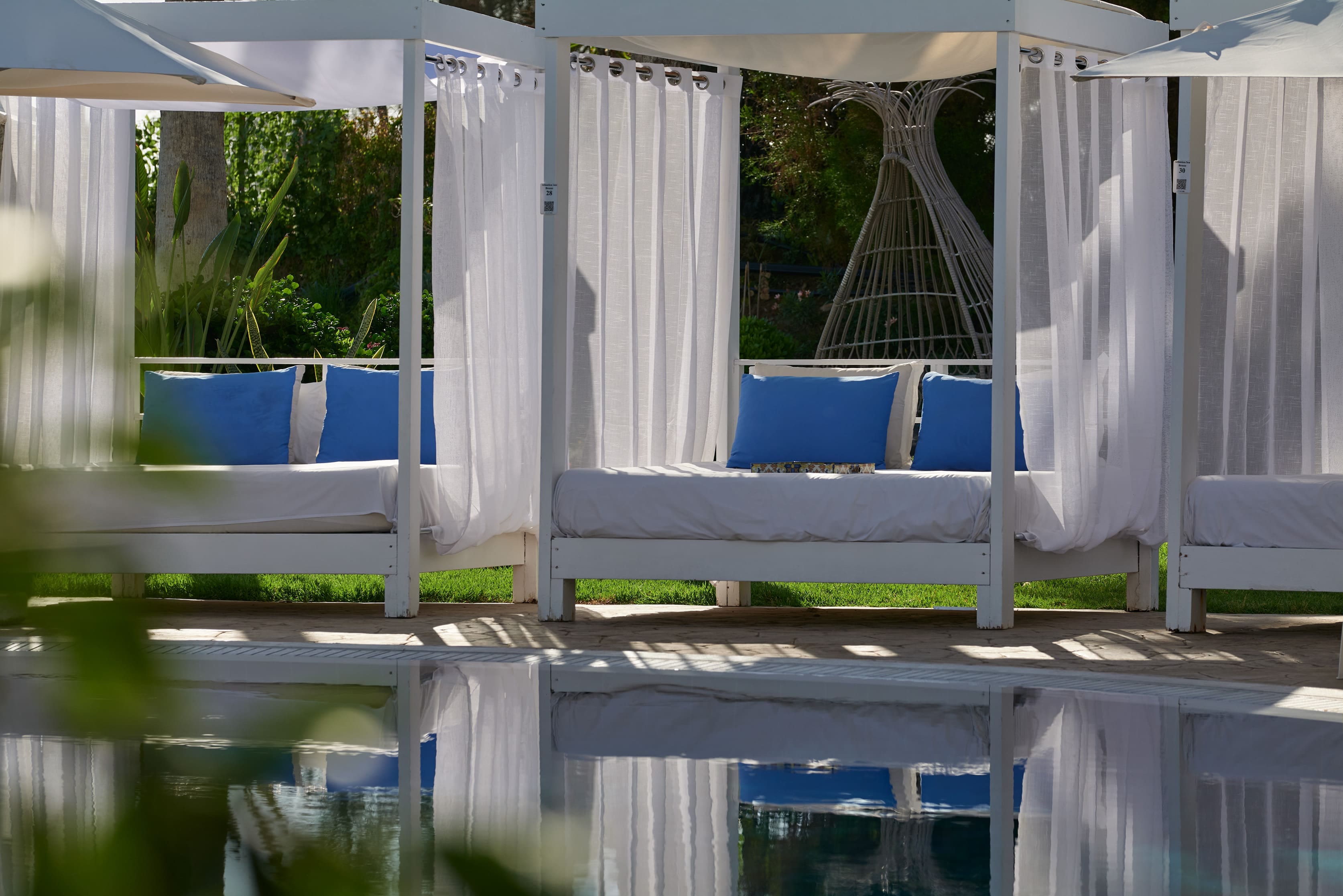 a deck with a chair and a table and a plant