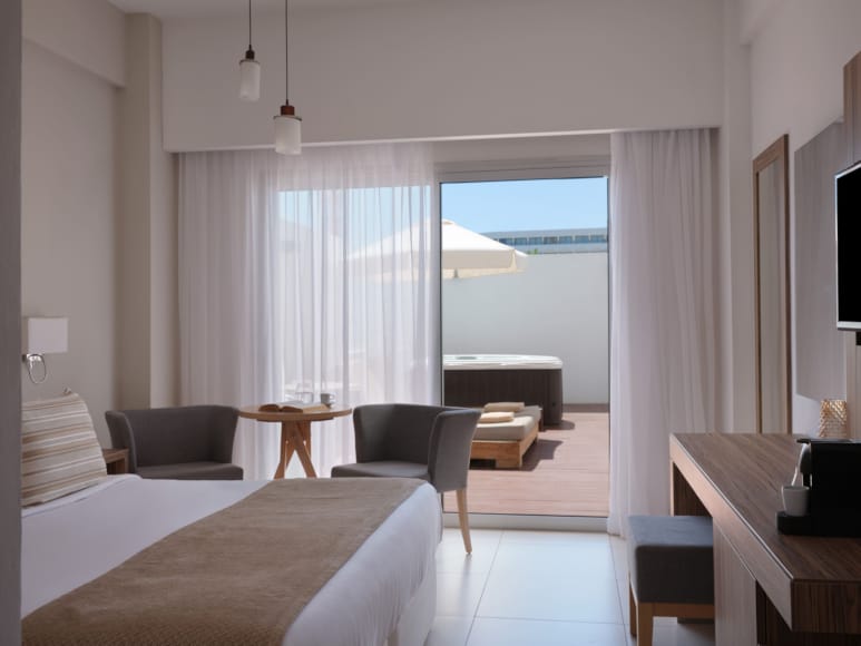 a bedroom with a large window