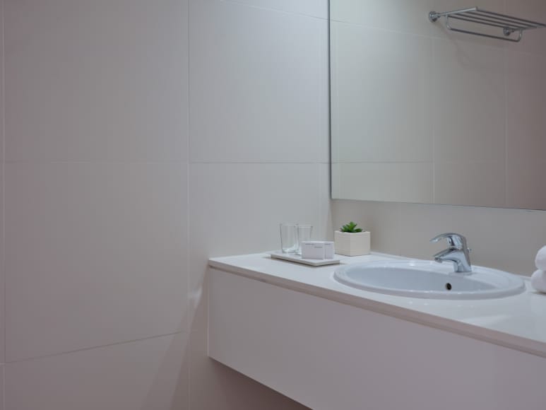 a bathroom with a sink and mirror