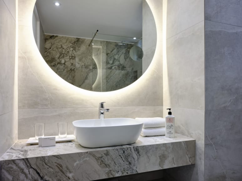 a bathroom with a large mirror