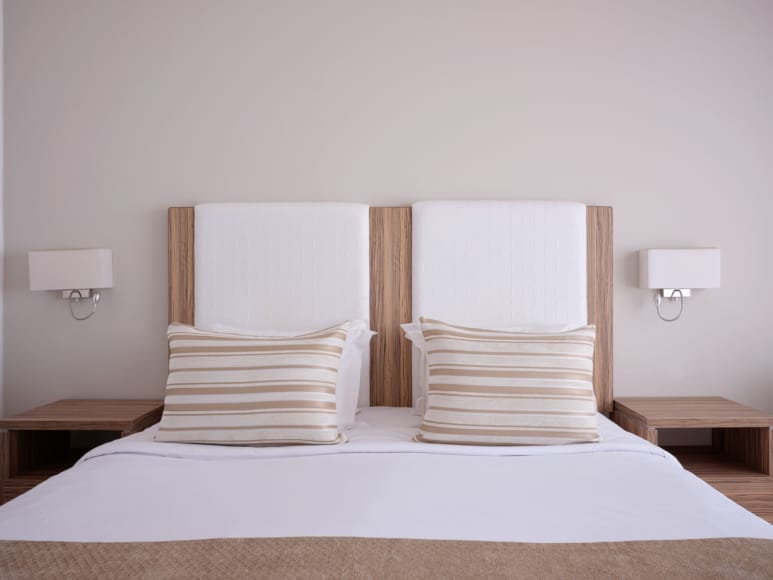 a bed with white sheets