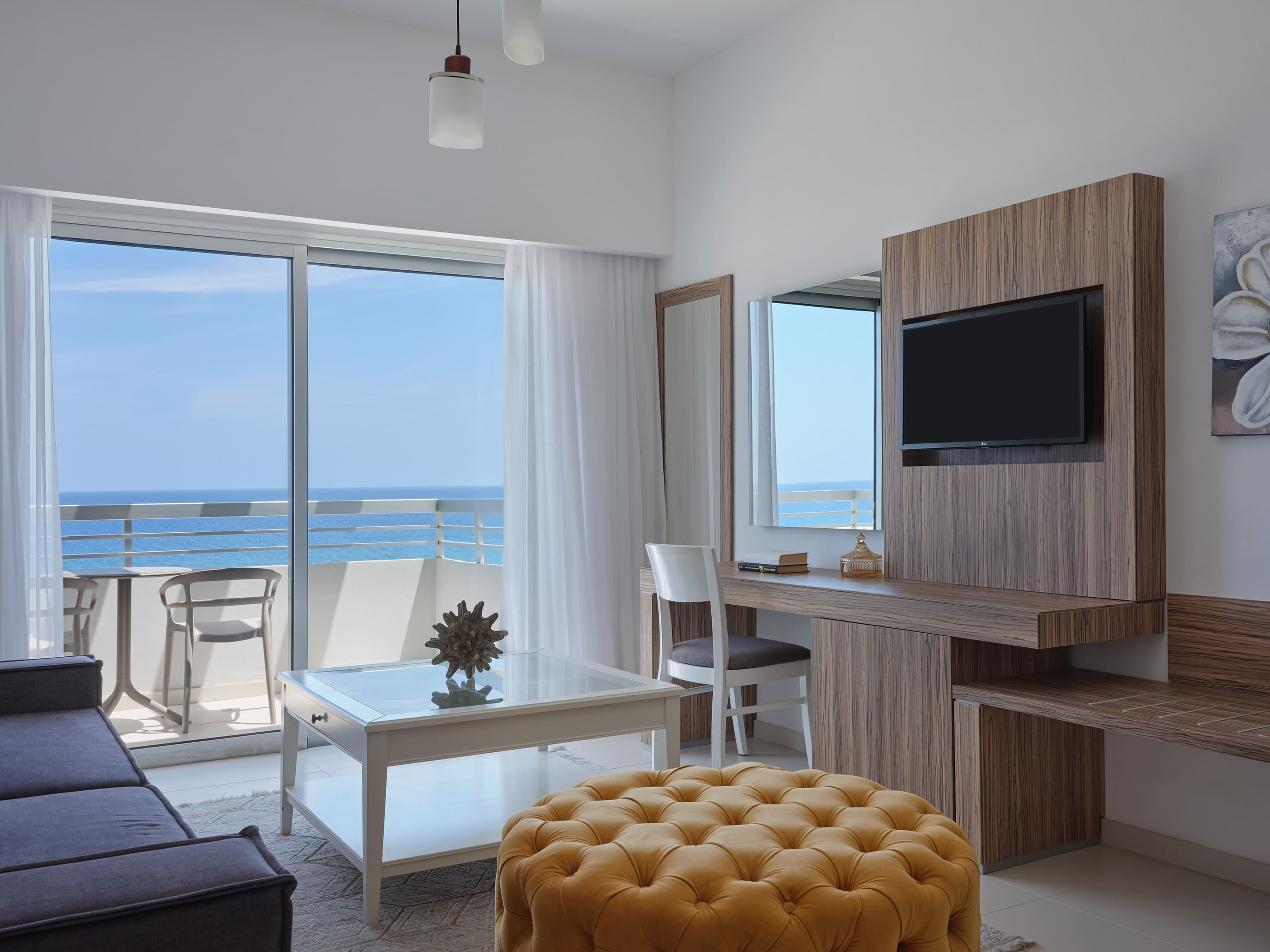 a living room with a tv and a table