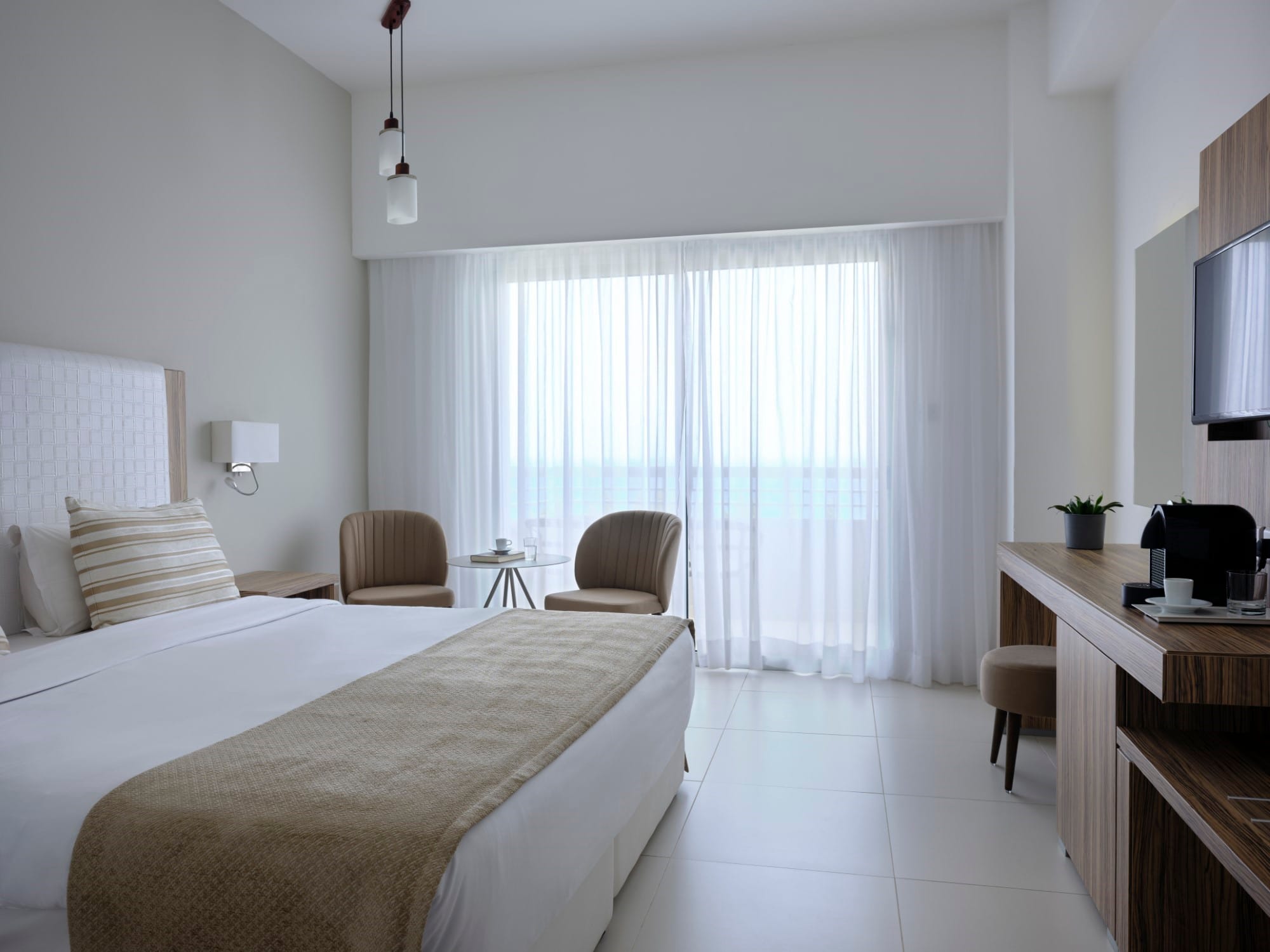 a bedroom with a bed and desk