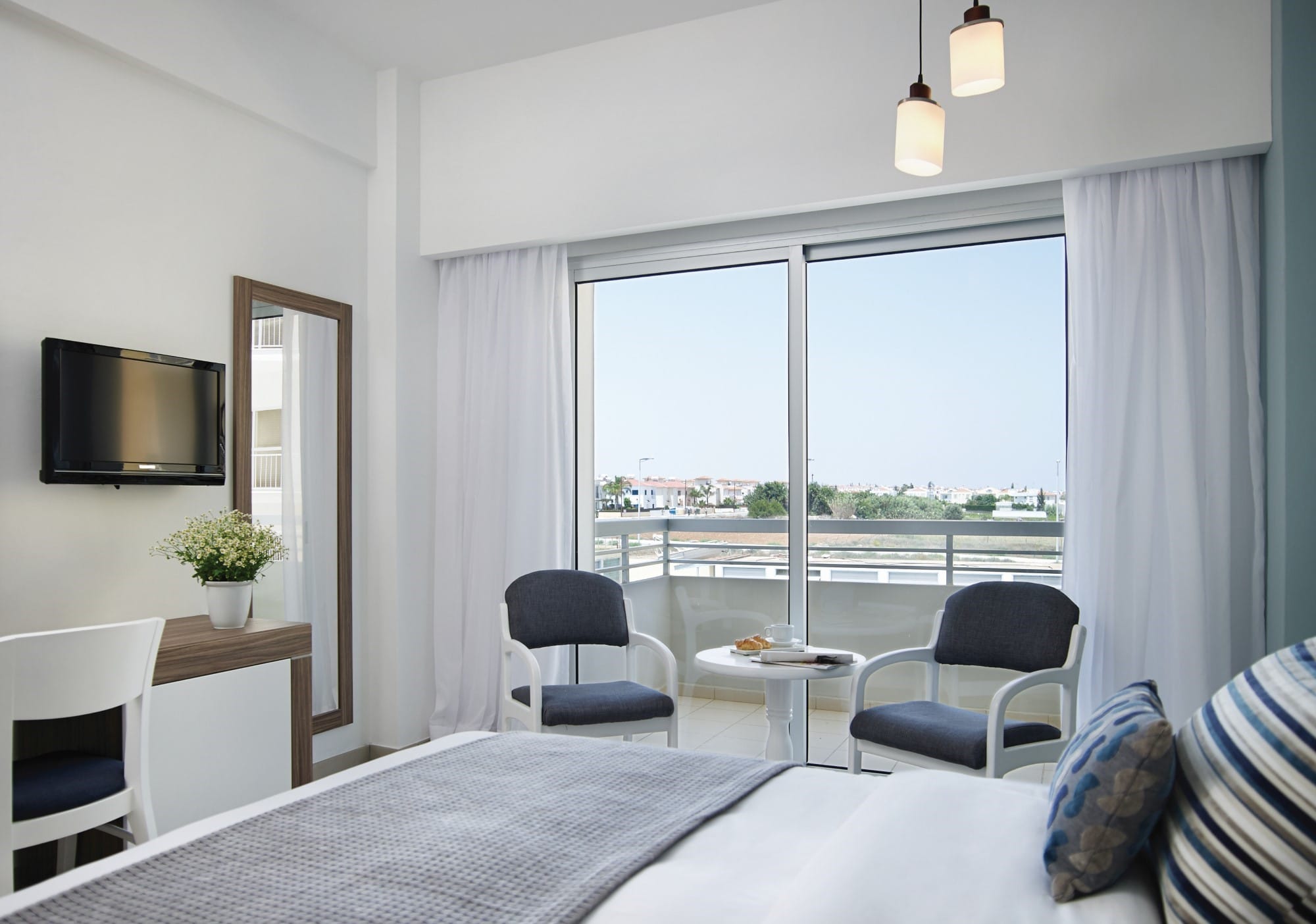 a bedroom with a large window