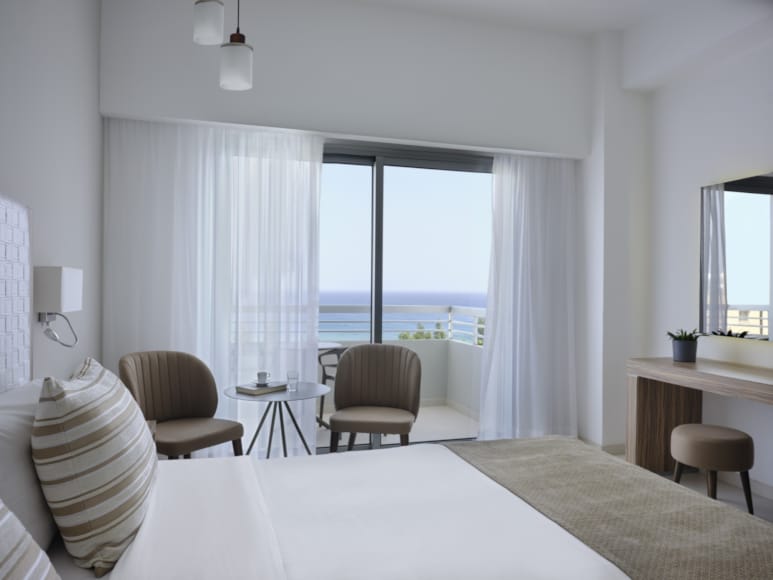 a bedroom with a large window