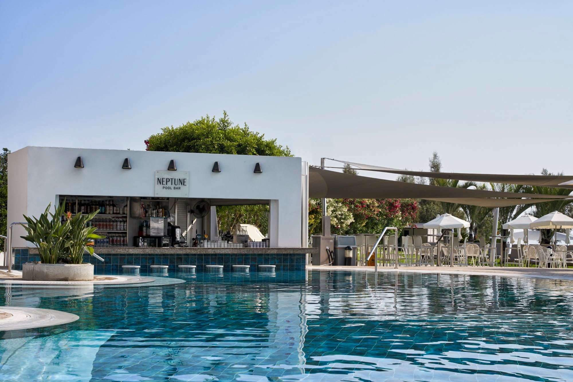 a swimming pool with a building in the background