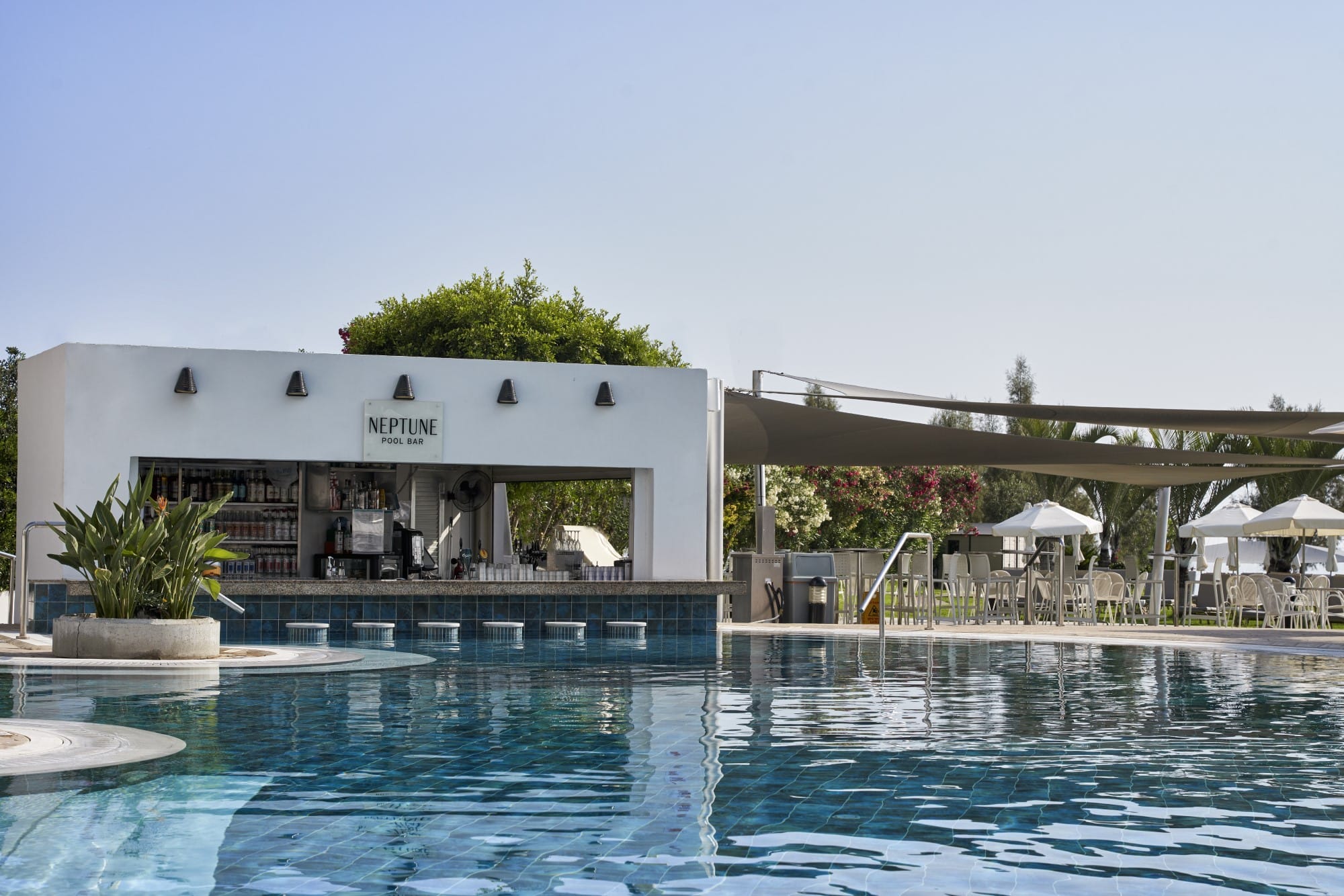 a swimming pool with a building in the background