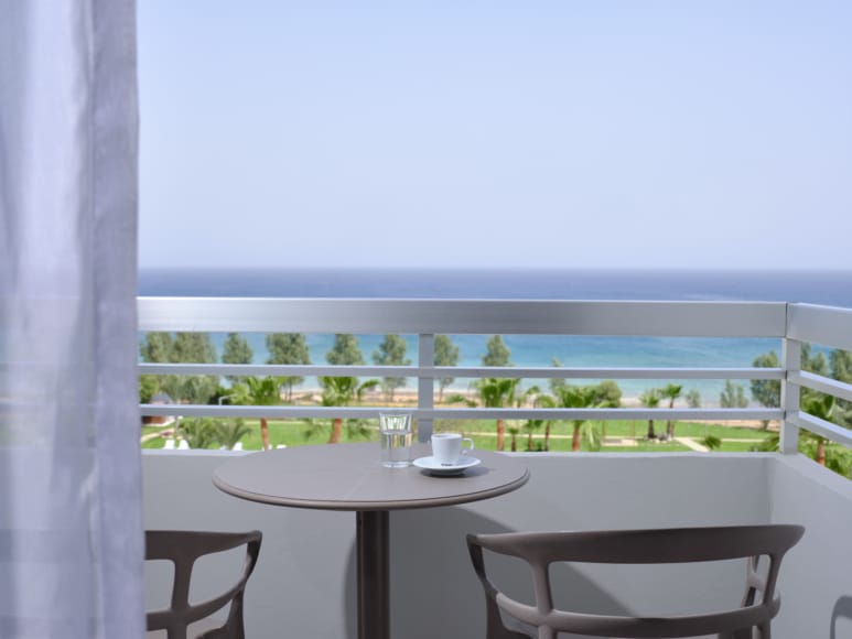 a table and chairs on a balcony