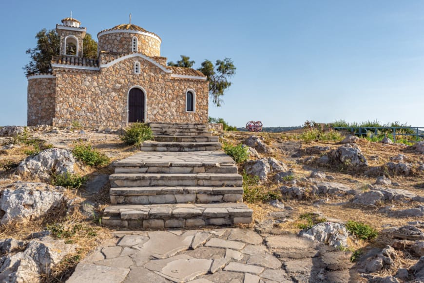 a stone building on a hill