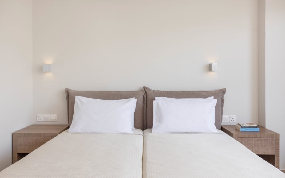 a couple of beds in a room