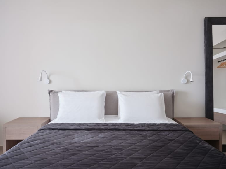 a bed with white pillows