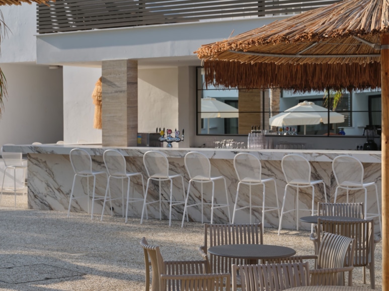 a group of chairs and tables outside