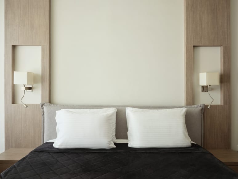 a bed with white pillows