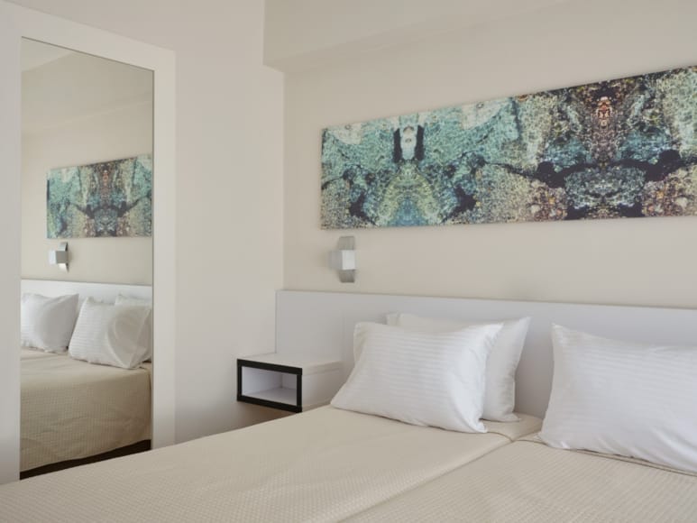 a bed with white pillows