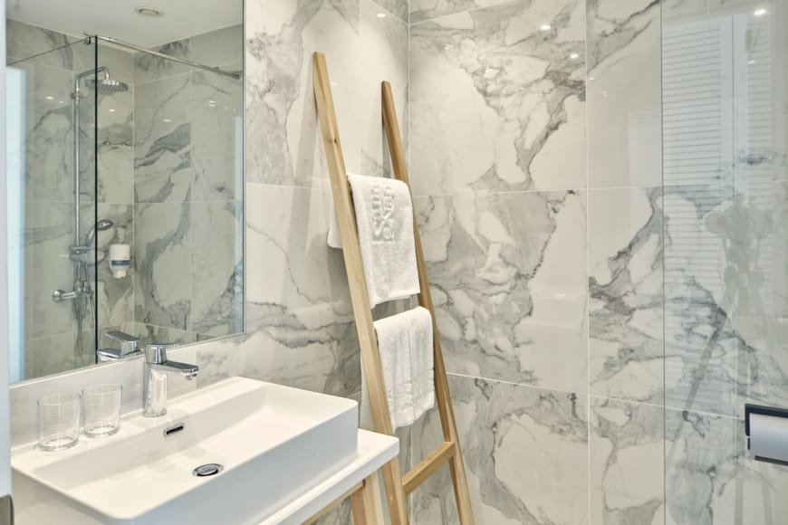 a bathroom with a mirror and a sink