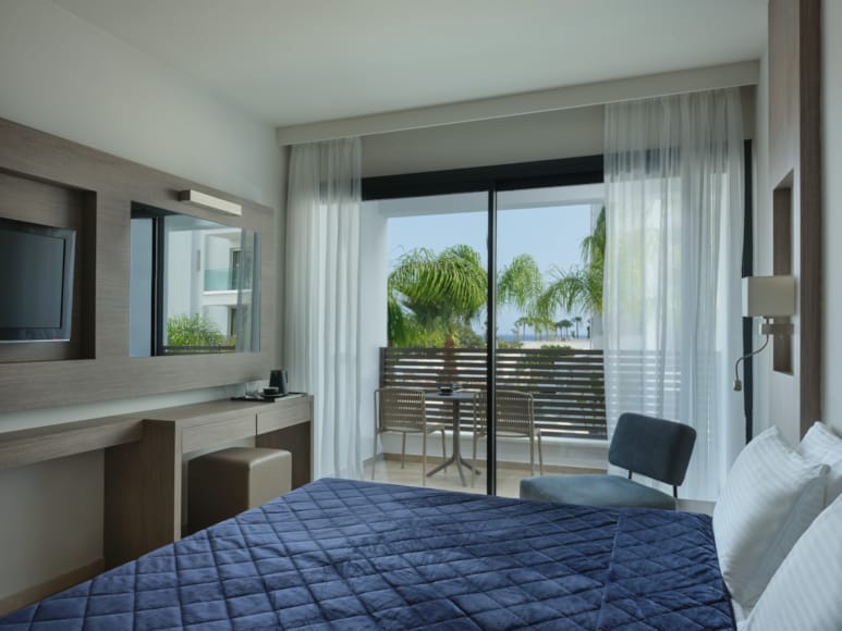 a bedroom with a balcony