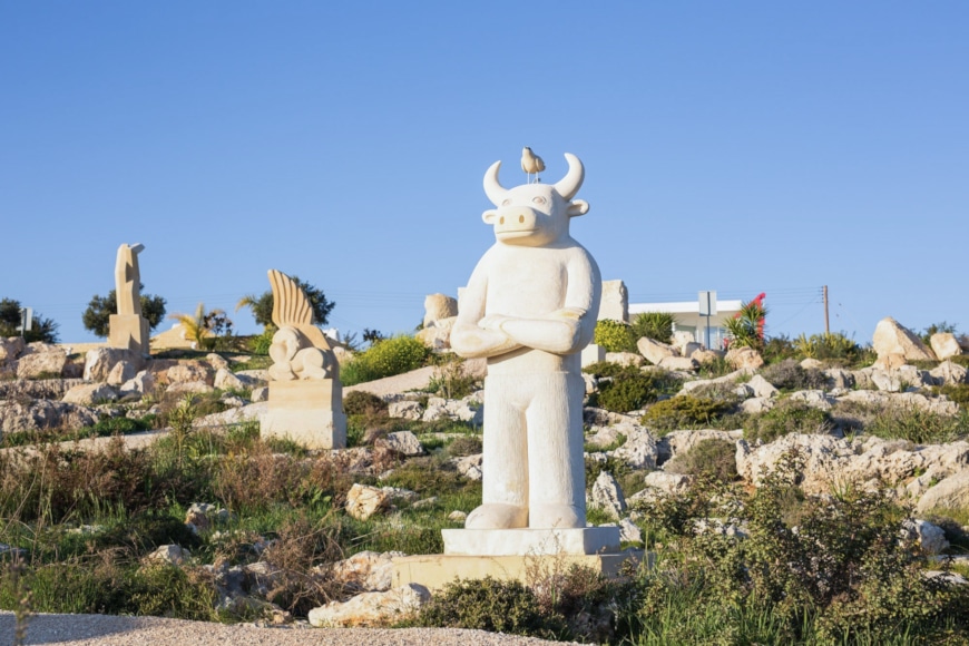 a statue of a person with horns