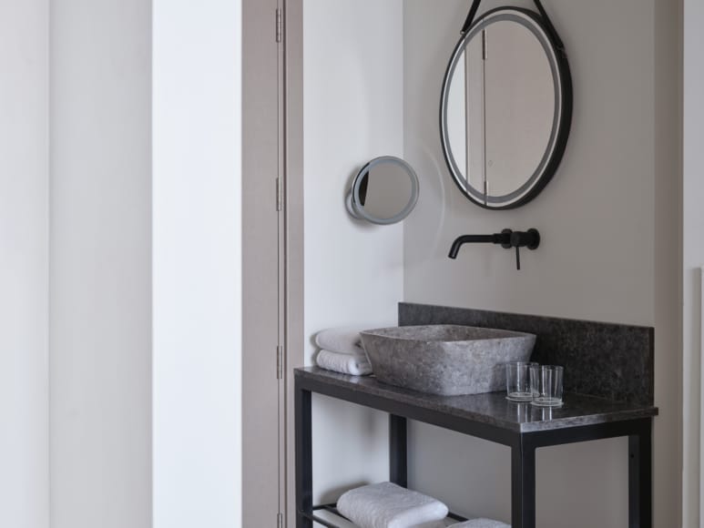 a bathroom with a sink and a mirror