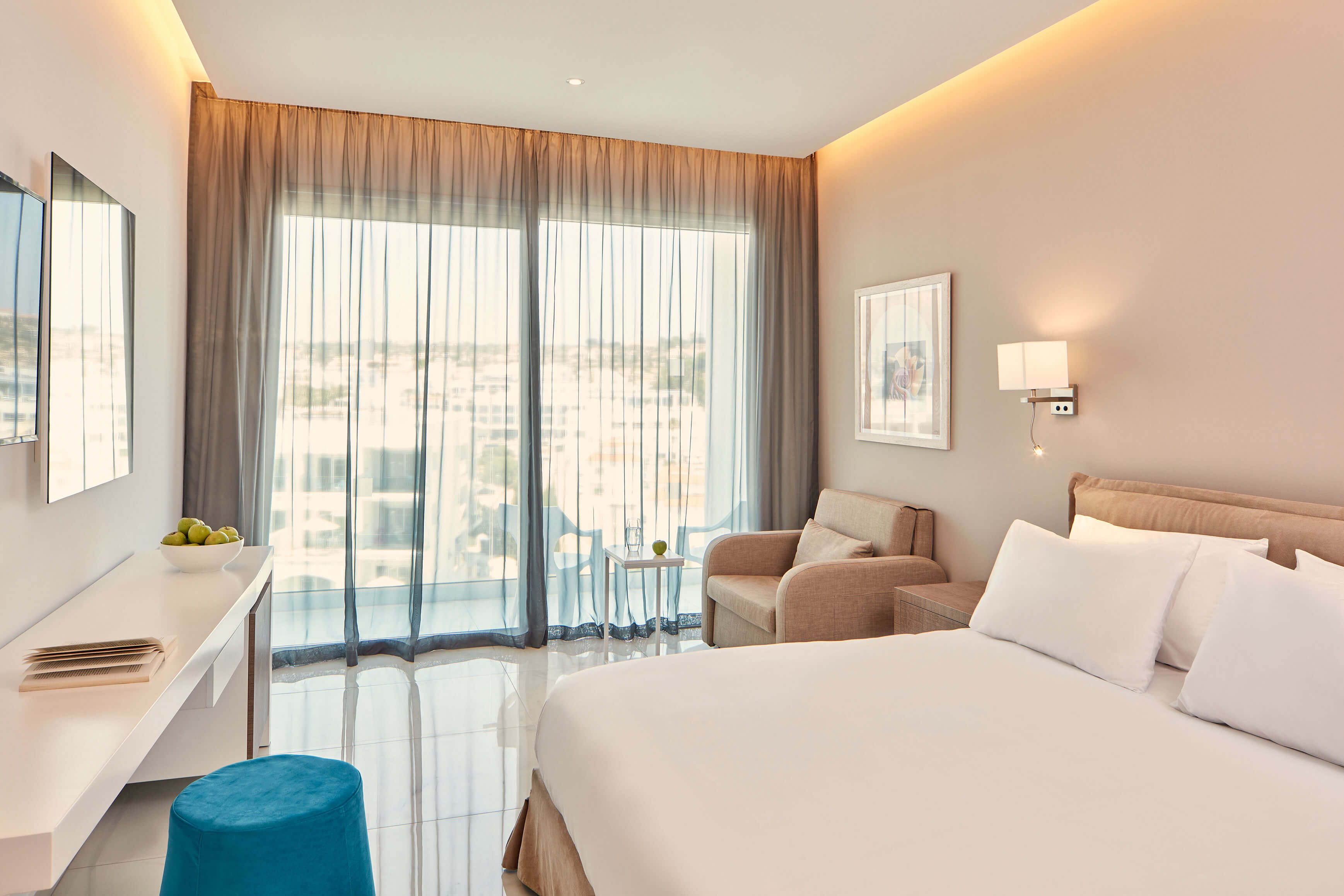 a bedroom with a bed and a chair